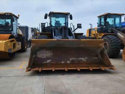 Newly used wheel loader and truck mounted crane waiting for refurbishment